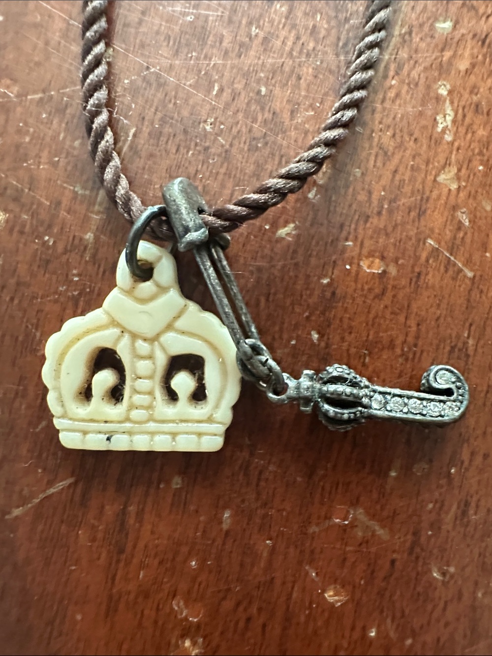 Juicy Couture Cream Crown and Antiqued Silver Sword Charm Necklace • NWOT